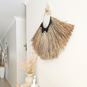 Zayana seagrass alang alang black wrapped pattern wall art hanging for coastal bohemian inspired home decor. Sustainable, eco-friendly, natural wall art for your home interior. Modern Coastal Boho wall decor handmade in Bali. 
Large natural wall hanging.