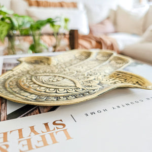 Hand casted brass hamsa hand tray. Perfect for beside styling, coffee table styling and adding a unique touch to coastal boho interior home styling 