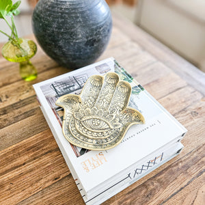 Hand casted brass hamsa hand tray. Perfect for beside styling, coffee table styling and adding a unique touch to coastal boho interior home styling 