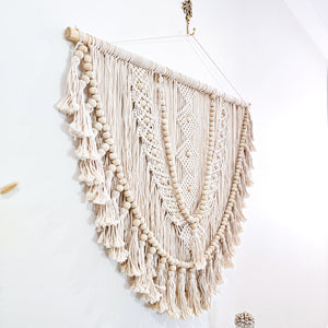 Kalee Macrame Wall Hanging large in natural tone macrame cotton. Perfect for coastal boho inspired home interior aesthetic. Wall statement piece.