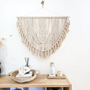 Kalee Macrame Wall Hanging large in natural tone macrame cotton. Perfect for coastal boho inspired home interior aesthetic. Wall statement piece.