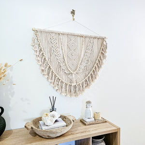 Kalee Macrame Wall Hanging large in natural tone macrame cotton. Perfect for coastal boho inspired home interior aesthetic. Wall statement piece.