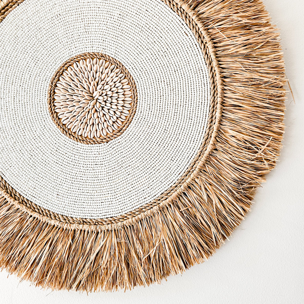 Raffia with white bead detailing and shell center wall art decor. Coastal, boho, Bohemian home decor. Natural wall art. Handmade Bali style wall art decor. Round wall art disc.