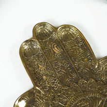 Brass hamsa hand home decor. Coffee table decor for coastal boho boheme home aesthetic. Casted from Brass with a beautiful carved design. Style your home with stunning Brass accents while bringing a unique, tribal touch to your finishing touches 